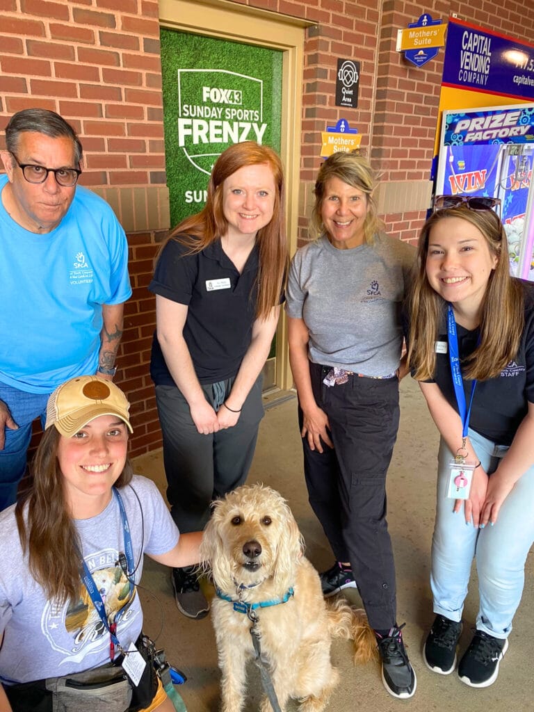 Group of people with a dog.