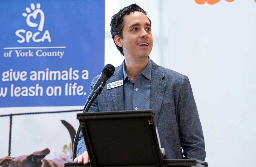 Speaker at SPCA event presentation.