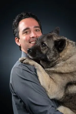 Person holding a large dog.